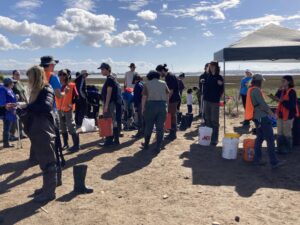 Photo of volunteers getting ready to pick up trash in the marsh